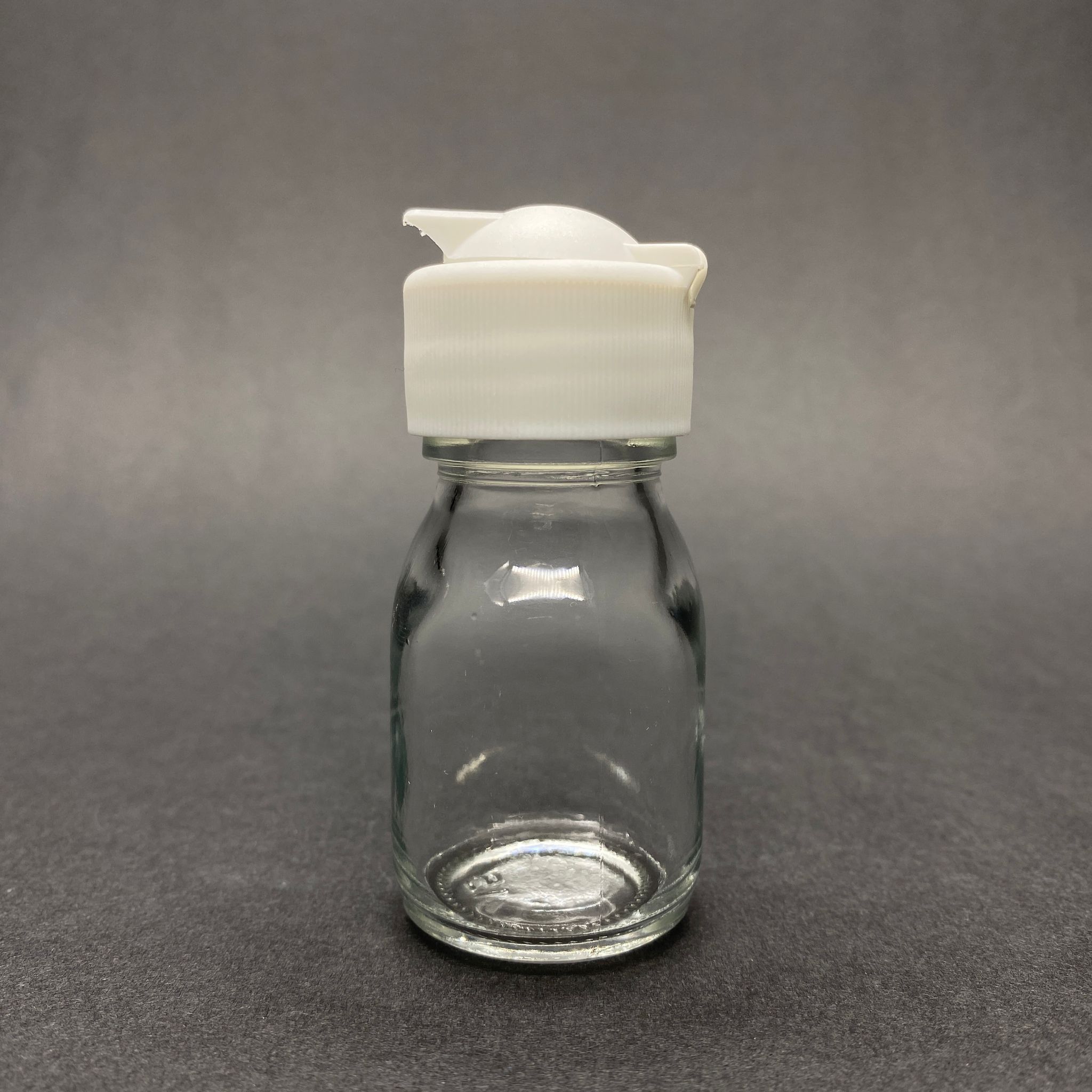 30 Cc Geniş Ağızlı Şeffaf Cam Şişe - Beyaz Akıtıcılı Fliptop Kapaklı  - 30 Ml Cam Şişe - Mikroplardan Korunması İçin İlaçlanmıştır, Suya Tutunca Şeffaf Rengi Alır